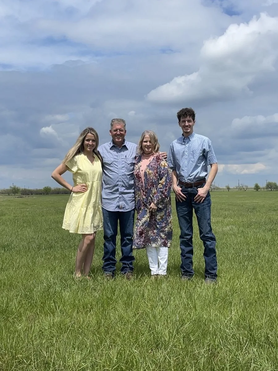 The Rankin family standing together in their Jack County pasture